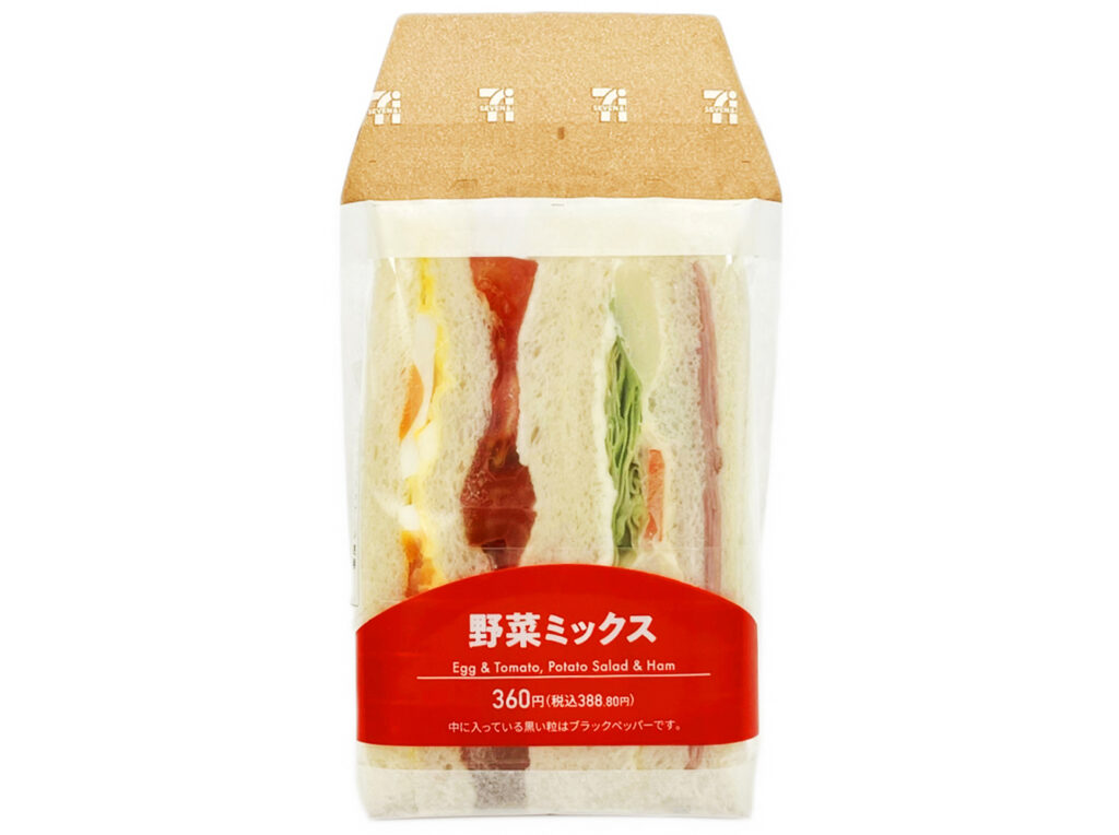 セブンイレブンの野菜ミックスサンドを比較する。税込価格：389円、カロリー：311kcal、1円あたりカロリー：0.80kcal/円、たんぱく質：9.2g、1円あたりたんぱく質：0.02g/円、脂質：16.7g、炭水化物：31.9g、糖質：29.8g、食物繊維：2.1g、食塩相当量：1.3g。多種類の具材を１度に楽しめる野菜ミックスサンドです。１組ごとに異なる具材と味付けを楽しめます。アレルギー：卵、乳、小麦。