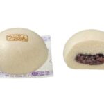 セブンイレブンのもちふわ×つぶつぶ つぶあんまん。税込価格：140円、カロリー：210kcal、たんぱく質：5.7g、脂質：2g、炭水化物：43.4g、糖質：41.3g、食物繊維：2.1g、食塩相当量：0.2g。関西地域で好まれる控えめな甘さで、風味と味を引き立てた良質なつぶあんを、もっちりふんわり食感の生地で包んだあんまんです。アレルギー：小麦 特定原材料に準ずる20品目: 大豆。