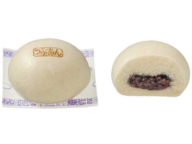 セブンイレブンのもちふわ×つぶつぶ つぶあんまん。税込価格：140円、カロリー：210kcal、たんぱく質：5.7g、脂質：2g、炭水化物：43.4g、糖質：41.3g、食物繊維：2.1g、食塩相当量：0.2g。関西地域で好まれる控えめな甘さで、風味と味を引き立てた良質なつぶあんを、もっちりふんわり食感の生地で包んだあんまんです。アレルギー：小麦 特定原材料に準ずる20品目: 大豆。