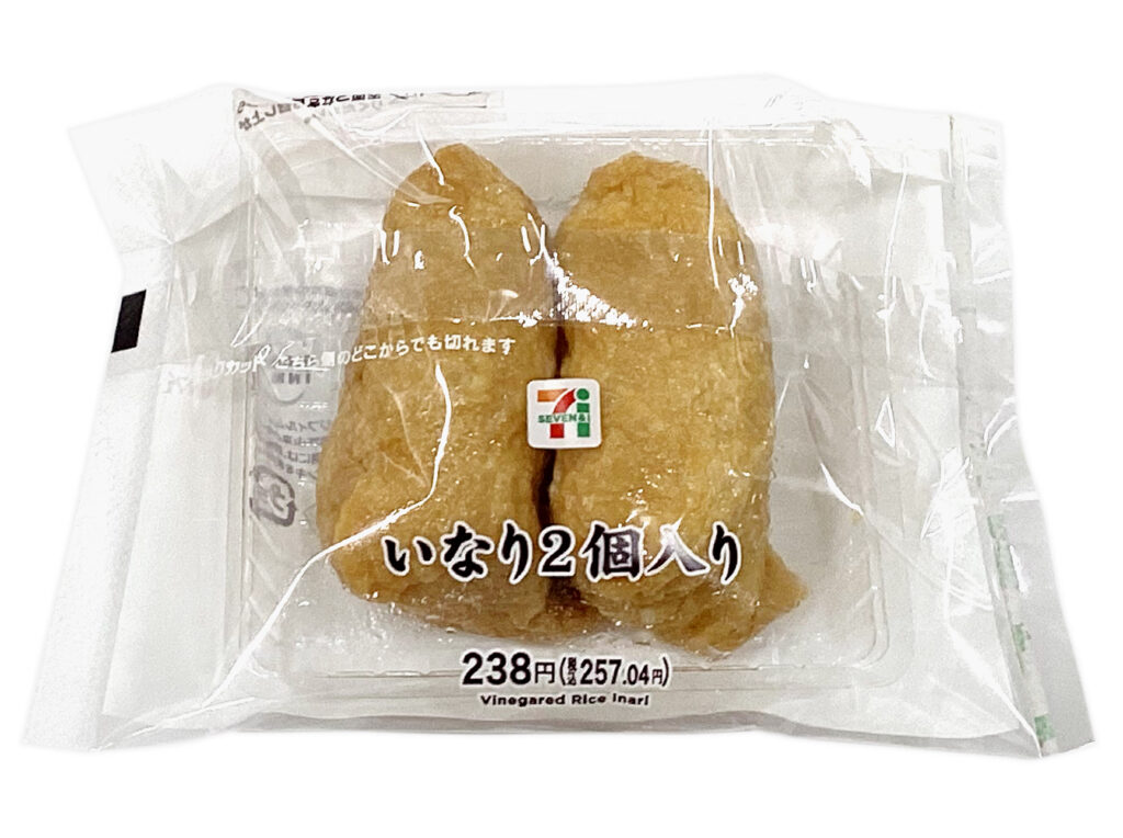 セブンイレブンのいなり ２個入りを比較する。税込価格：257円、カロリー：192kcal、1円あたりカロリー：0.75kcal/円、たんぱく質：5.4g、1円あたりたんぱく質：0.02g/円、脂質：3.7g、炭水化物：34.7g、糖質：33.6g、食物繊維：1.1g、食塩相当量：1.4g。さっぱりとした酢飯を甘辛く煮たジューシーないなり皮で包んだ、いなり寿司２個の詰め合わせです。アレルギー：小麦。