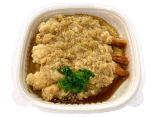 セブンイレブンのえび天玉子とじ丼を比較する。税込価格：754円、カロリー：565kcal、1円あたりカロリー：0.75kcal/円、たんぱく質：17.8g、1円あたりたんぱく質：0.02g/円、脂質：15.8g、炭水化物：90.2g、糖質：85.8g、食物繊維：4.4g、食塩相当量：4g。だしをたっぷり含んだ海老天を玉子でとじた、海老天とじ丼です。アレルギー：卵、小麦、えび。