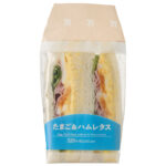 セブンイレブンのたまご＆ハムレタスサンドを比較する。税込価格：346円、カロリー：307kcal、1円あたりカロリー：0.89kcal/円、たんぱく質：12.5g、1円あたりたんぱく質：0.04g/円、脂質：17.8g、炭水化物：24.8g、糖質：23.5g、食物繊維：1.3g、食塩相当量：1.5g。たまごとハムをたっぷりはさんだサンドイッチです。アレルギー：卵、乳、小麦。