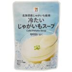 セブンイレブンの７プレミアム 冷たいじゃがいもスープ。税込価格：192円、カロリー：84kcal、たんぱく質：1.1g、脂質：5.3g、炭水化物：8.6g、糖質：7.2g、食物繊維：1.4g、食塩相当量：1g。北海道産じゃがいもを使用し、野菜の風味をいかして仕上げた冷たいスープです。アレルギー：乳。