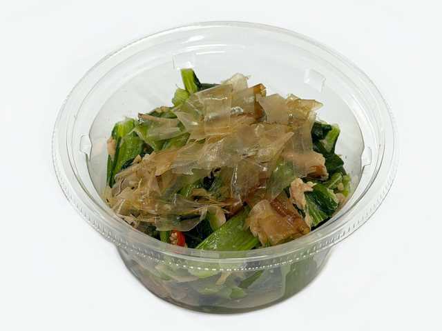 セブンイレブンのやみつき無限こまツナを比較する。税込価格：279円、カロリー：91kcal、1円あたりカロリー：0.33kcal/円、たんぱく質：5.6g、1円あたりたんぱく質：0.02g/円、脂質：5.6g、炭水化物：5.5g、糖質：3.4g、食物繊維：2.1g、食塩相当量：1.3g。小松菜とツナをごま油で和えた副菜にもおつまみにもなる商品です。アレルギー：小麦。