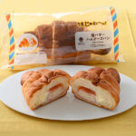 ファミリーマートの【うまじゅわ~っ!塩バターパン】塩バターハムチーズパンを比較する。税込価格:185円。フランスパン生地とデニッシュ生地を貼り合わせた生地に、ハムを巻き込み、発酵バター入り塩マーガリンを絞って焼きあげ、チーズクリームを入れました。