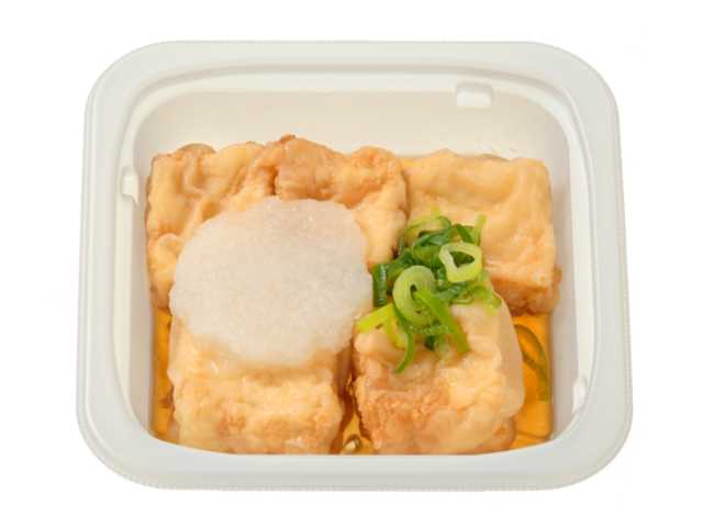 セブンイレブンのおろしとねぎの揚げだし豆腐を比較する。税込価格：397円、カロリー：233kcal、1円あたりカロリー：0.59kcal/円、たんぱく質：14.9g、1円あたりたんぱく質：0.04g/円、脂質：15.7g、炭水化物：9.4g、糖質：6.6g、食物繊維：2.8g、食塩相当量：1.2g。かつお出汁の旨みをしっかり効かせた揚げだし豆腐です。アレルギー：卵、小麦。