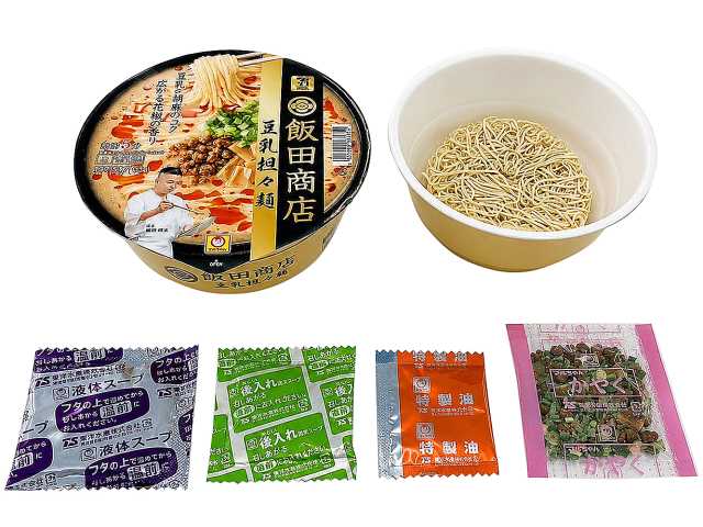 セブンイレブンの７プレミアムゴールド 飯田商店 豆乳担々麺を比較する。税込価格：354円、カロリー：517kcal、1円あたりカロリー：1.46kcal/円、たんぱく質：16.2g、1円あたりたんぱく質：0.05g/円、脂質：21.2g、炭水化物：67.3g、糖質：63.2g、食物繊維：4.1g、食塩相当量：6.1g。飯田商店考案の特別メニューをカップ麺で。鶏と豚をベースにした醤油味スープに豆乳・すりごまを合わせ、ラー油の辛味と花椒の香りを利かせた担々麺です。アレルギー：卵、乳、小麦。