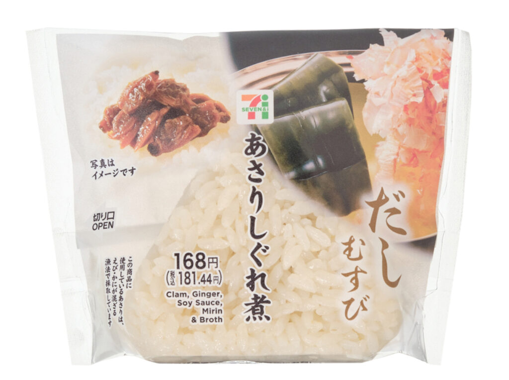 セブンイレブンのだしむすび あさりしぐれ煮を比較する。税込価格：181円、カロリー：185kcal、1円あたりカロリー：1.02kcal/円、たんぱく質：5g、1円あたりたんぱく質：0.03g/円、脂質：1.1g、炭水化物：39.5g、糖質：37.9g、食物繊維：1.6g、食塩相当量：1.9g。だしの芳醇な香りと深い旨みを味わえるだし飯おむすびです。中具は、あさりのしぐれ煮を合わせました。アレルギー：小麦、かに。