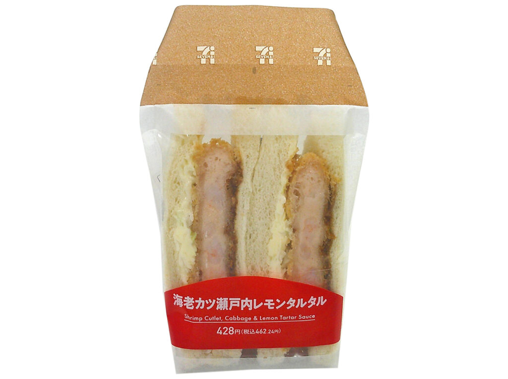 セブンイレブンの海老カツ瀬戸内レモンタルタルサンドを比較する。税込価格：462円、カロリー：418kcal、たんぱく質：12.8g、脂質：20.3g、炭水化物：47g、糖質：45g、食物繊維：2g、食塩相当量：2.5g。プリプリとした海老の食感に、瀬戸内レモンを使ったさっぱりタルタルソースを合わせた、最後まで食べやすい味わいです。アレルギー：卵、乳、小麦、えび。